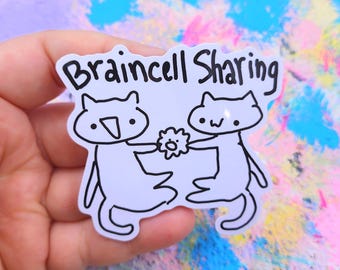May include: A white sticker with the text "Braincell Sharing" above two cartoon cat figures. The cats are holding a flower. The sticker has a black outline and is on a colorful background.
