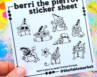 May include: A white sticker sheet featuring multiple black and white illustrations of clown-like characters. The text "berri the pierrot sticker sheet" is at the top, with "berri is here to smile! it tries it's best." and "@thefablemarket" at the bottom.