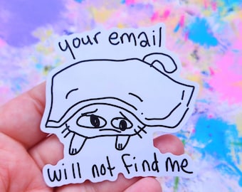 May include: A white sticker with a cartoon illustration of a creature hiding under a blanket. The sticker has the text "your email will not find me" in black handwritten font.