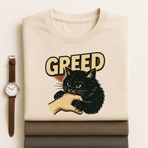 Greed Cat – Vintage Black Cat Biting Hand Graphic Tee | Dark Humor Retro Shirt for Cat Lovers & Edgy Streetwear Fans