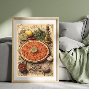 May include: A framed print featuring a detailed illustration of a round, reddish-orange dish, possibly pizza or a similar flatbread, garnished with a lemon slice. Surrounding the dish are ingredients like lemons, herbs, and onions, with a bottle of oil.