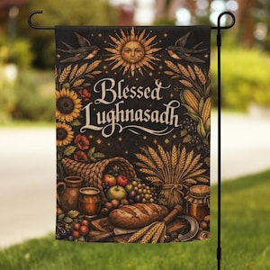 May include: A garden flag with a dark background featuring the text "Blessed Lughnasadh". The flag has illustrations of sunflowers, a sun with a face, birds, and a cornucopia filled with fruits and vegetables.