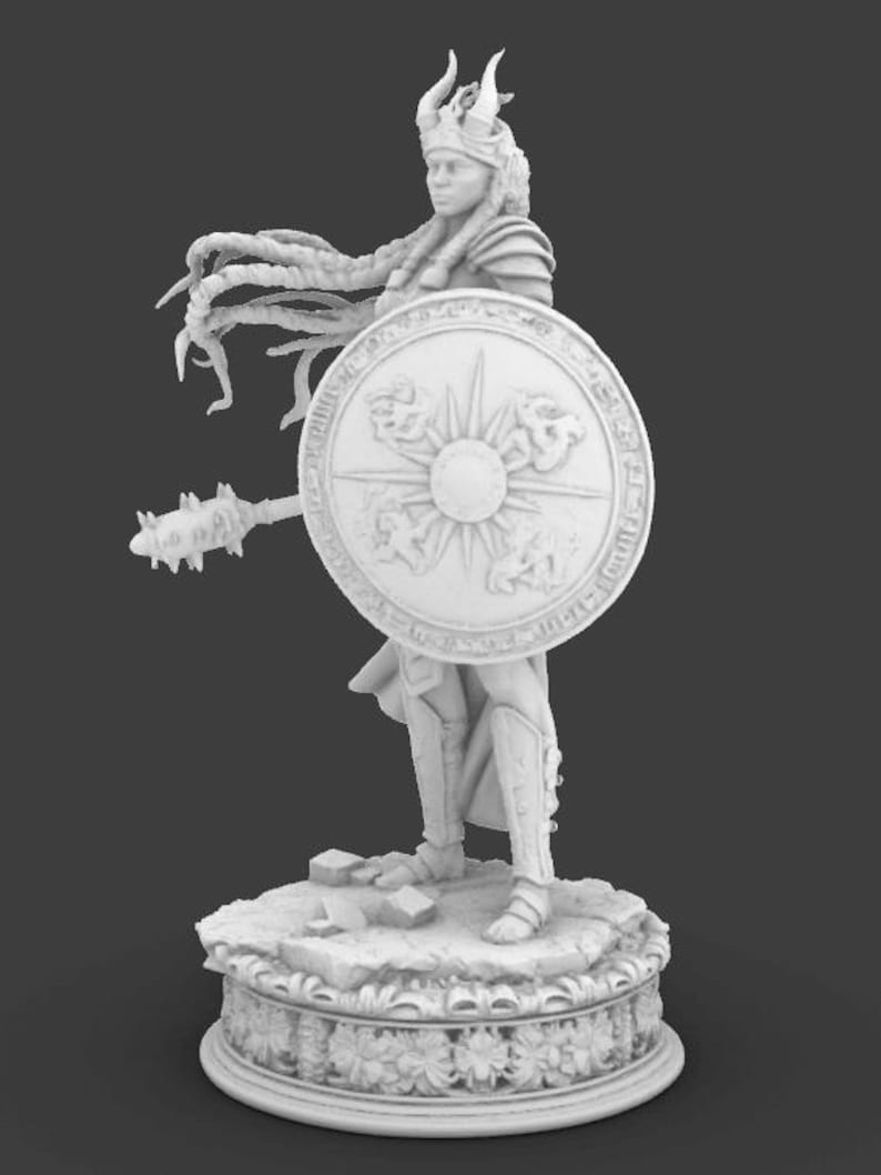 May include: A monochrome figurine of a warrior woman, holding a shield and a mace. She wears armour and a horned helmet, with long, flowing hair. The shield features a sunburst design. The figurine stands on a decorative base with floral patterns.