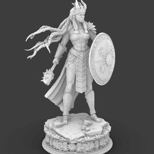 May include: A detailed 3D-printed figurine of a warrior woman, clad in armour and holding a mace and shield. The figure stands on a decorative base, showcasing intricate details. The warrior wears a crown and has long, flowing hair. The overall colour is a neutral, light grey.