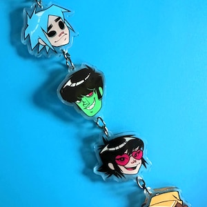 Chaveiro de acrílico com o tema Song Machine do Gorillaz