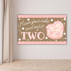 May include: A pink and brown birthday banner with the text "Have your cake and eat it TWO." A heart-shaped cake with the name "Elsie" is on the right. White polka dots and hearts decorate the banner.