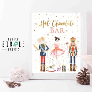 May include: A printable sign for a hot chocolate bar featuring a ballerina, a nutcracker, and a mouse king. The sign has a white background with gold glitter accents and the text "Hot Chocolate Bar" in gold glitter.
