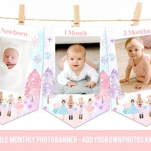 May include: A set of three pennant-shaped photo banners hanging from a string with wooden clips. Each banner features a white center for photos, pink and purple watercolor trees, nutcracker characters, and text reading Newborn, 1 Month, and 2 Months.