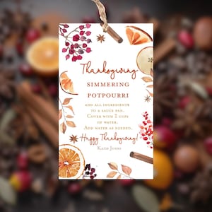 May include: A Thanksgiving-themed tag with watercolor illustrations of oranges, cinnamon sticks, and berries. The text reads "Thanksgiving Simmering Potpourri" with instructions and a "Happy Thanksgiving!" message.