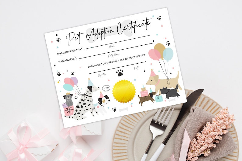 May include: A printable pet adoption certificate with a white background and colorful cartoon dogs wearing party hats. The certificate has blank lines for the adopter's name, pet's name, and signature. The text reads "Pet Adoption Certificate" and "This certifies that ____ has adopted ____. I promise to love and take care of my pet."