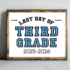 May include: A framed print with the text "LAST DAY OF THIRD GRADE 2025-2026". The text is in black and blue, with a white background. The frame is made of wood.
