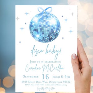 May include: A blue disco ball baby shower invitation with the text "disco baby!" and "Join us in celebrating Caroline McCarlton September 16 from 6-9pm 3939 Disco Ball Way, Danceville 93932 RSVP: Kim at 555-9393 or bridalstore@email.com Registry at baby store"