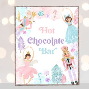May include: A printable sign for a hot chocolate bar with a pink, blue, and white watercolor background. The sign features illustrations of a ballerina, a nutcracker, and a mouse. The text on the sign reads "Hot Chocolate Bar".