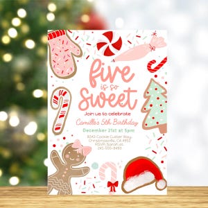 May include: A festive birthday invitation with a Christmas theme. The invitation features gingerbread cookies, candy canes, and a Santa hat. Text reads "five is so sweet" and invites guests to Camille's 5th birthday on December 21st.