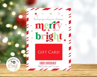 May include: A white gift card with a red and white candy cane border. The card features the words "merry & bright" in red, pink, and green. It also includes the text "GIFT CARD" and "MERRY CHRISTMAS!" with a personalized name.