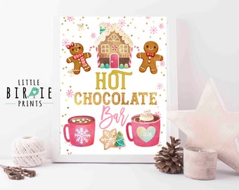 May include: A printable sign with a pink and gold design featuring gingerbread people, a gingerbread house, and mugs of hot chocolate. The text reads "Hot Chocolate Bar".