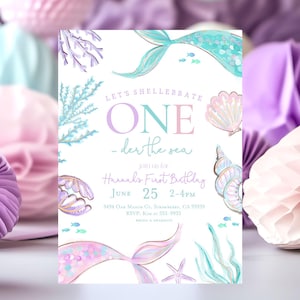 May include: A pastel-coloured mermaid-themed birthday invitation. The design includes watercolour illustrations of mermaid tails, shells, and seaweed. The text reads "Let's Shellebrate ONE - der the sea" and includes event details.
