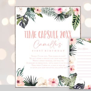 May include: A printable time capsule for a first birthday party. The design features tropical leaves and flowers in pink and green. The text reads "Time Capsule 20XX Camille's First Birthday".