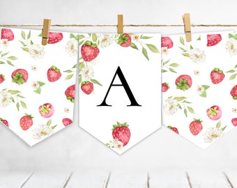 May include: A white banner with a strawberry and floral pattern. The center banner has the letter "A" in black.