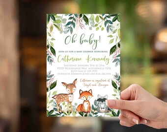 May include: A baby shower invitation with a woodland theme. The invitation features a deer, fox, and raccoon surrounded by green leaves. The text reads "Oh baby!" and "Join us for a baby shower honoring Catherine Kennedy".