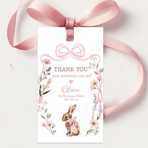 May include: Pink thank you tag with a floral design and a bunny rabbit. The tag says "Thank You for Hopping On By!" and includes the name Olivia and the date 04-10-xx.