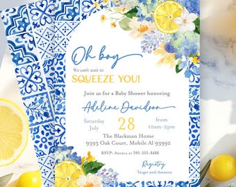 May include: A rectangular baby shower invitation card featuring a blue and white tile pattern border, watercolour lemon slices, and floral accents. The text reads: Oh boy, We can't wait to SQUEEZE YOU!, Adeline Davidson, Saturday July 28, 10am-2pm.