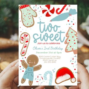May include: A festive invitation for a second birthday party. The design features cookie-themed illustrations, including a gingerbread person, candy cane, and Santa hat. The text reads "two sweet" and includes party details.