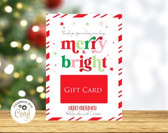 May include: A Christmas-themed gift card with a red and white candy cane border. The card features the words "merry & bright" in red, green, and pink, with "GIFT CARD" in a red rectangle. The text "MERRY CHRISTMAS!" is also visible.
