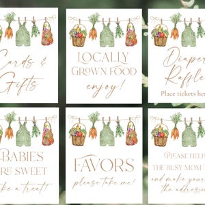 Op de afbeelding: Zes witte kaarten met aquarel illustraties van groenten, overalls en manden die aan een waslijn hangen. Tekst op de kaarten: "Cards & Gifts", "Locally Grown Food", "Diaper Raffle", "Babies Are Sweet", "Favors" en "Please Help".
