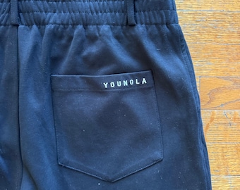 Pantalones de vestir YoungLA para hombre, negros, plisados, de corte cónico, talla 34L, con cintura elástica.