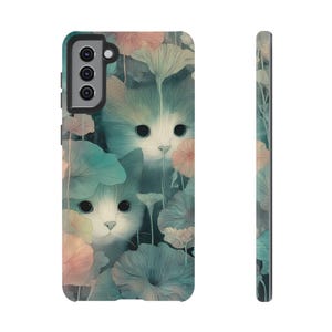 May include: A phone case featuring a whimsical illustration of two white and blue kittens peeking through pastel-colored flowers and foliage. The case has a black border and a side view showing a matching floral design.