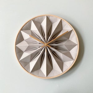 Wooden origami wall clock