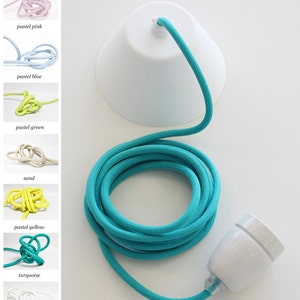 May include: A turquoise electrical cord with a white ceramic light socket and a white lampshade. The cord is coiled and ready to be used.  For a good impression of all of our cord colors you can visit our pinterest page www.pinterest.com/snowpuppe/cords
