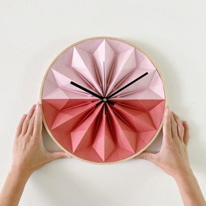 Wooden paper origami wall clock blush pink and rust red, by Studio Snowpuppe