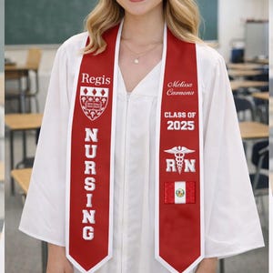 May include: A red and white graduation sash with the word "Regis" and a crest on one side, and the name "Melissa Camona" and "Class of 2025" on the other. The sash also features a medical symbol and the letters "RN".