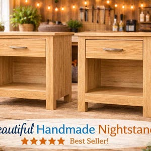 May include: A white ceramic mug with a black handle and the text "But First, Coffee" in a bold, black font. The mug is set against a blurred background, suggesting a cozy setting.