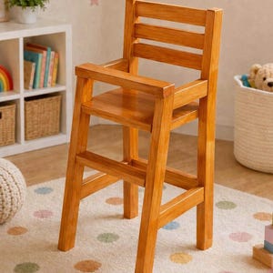 May include: A tall wooden high chair with a natural honey-colored finish. The chair features a slatted backrest, flat armrests, a square seat, and four sturdy legs connected by horizontal support bars for stability and structural integrity.