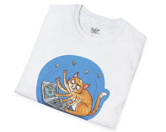 May include: White t-shirt featuring a cartoon cat with multiple arms working on a laptop. The cat is orange with a blue background and several floating icons. The shirt has a crew neck and the text "DESIGN CORNER CO."
