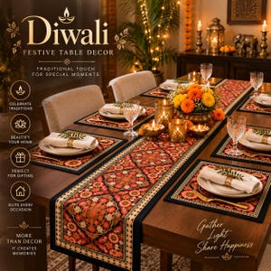 May include: A dining table set featuring a dark runner and placemats with a vibrant orange, red, and black floral mandala pattern. The setting includes white plates, cream napkins with gold rings, clear glassware, and gold-toned tea light holders.