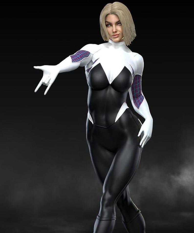 May include: A figure in a black and white superhero costume with a high collar and white gloves. The costume has a spider-web design on the arms. The figure has short blonde hair and is posed with one hand making a gesture.