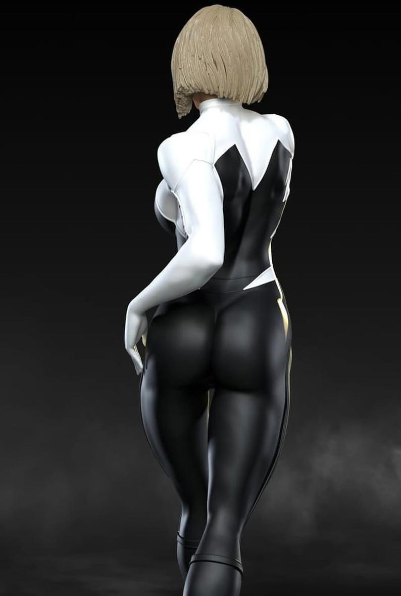 May include: A figure in a black and white bodysuit with a blonde bob hairstyle. The suit has white sleeves and accents, with a black torso and legs. The figure is posed with one hand at their side, and the other hand is out of frame.