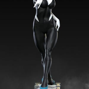 May include: A statue of a female superhero in a black and white bodysuit with a blonde bob hairstyle. The figure is standing on a stone structure and wearing blue shoes. The overall aesthetic is a comic book or fantasy theme.