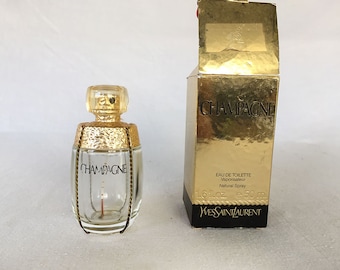 Frasco de perfume Champagne YSL Yves Saint Laurent, vintage e raro, de 1993, com textura e detalhes dourados. Design de alta costura francês. Fabricado na França.