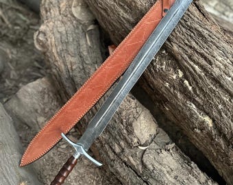 Espada vikinga de acero de Damasco forjada a mano: empuñadura de palisandro y funda de cuero.