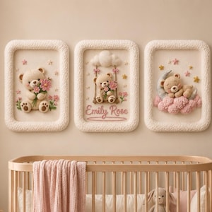May include: Three rectangular wall art pieces with textured cream frames featuring 3D teddy bear illustrations. The left shows a bear with flowers, the center shows a bear on a swing with the name Emily Rose, and the right shows a bear sleeping on a moon.