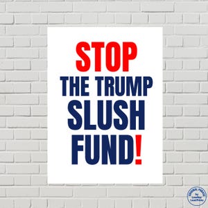 May include: A white poster with the words "STOP THE TRUMP SLUSH FUND!" in red and blue. The poster is displayed against a white brick wall. The phrase "Original Phrase by Lowkey Loud Prints" is in the bottom right corner.