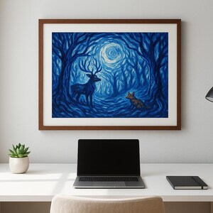 May include: A framed art print depicting a blue forest scene with a deer and a fox. The artwork features a full moon and stylized trees. The frame is brown, and the print is displayed on a white wall above a desk.
