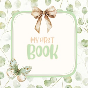 May include: A baby book design with a light green border and the words "MY FIRST BOOK" in soft colors. A butterfly and a bow adorn the design, set against a background of watercolor eucalyptus leaves.
