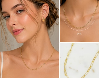 May include: A gold-colored chain necklace with rectangular links, shown on a person's neck. The necklace is approximately 16 inches long. The image also shows a close-up of the necklace's links and a person wearing gold hoop earrings.