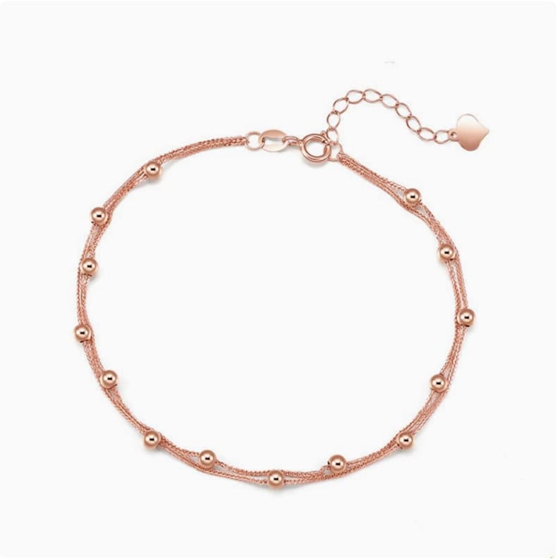 18K rose gold Starry Sky double row beaded bracelet on white background